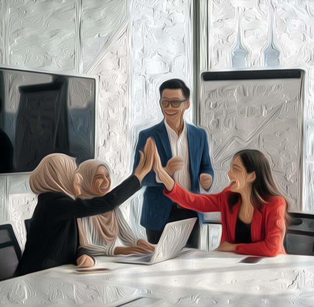 Team members celebrating with a high five in the office